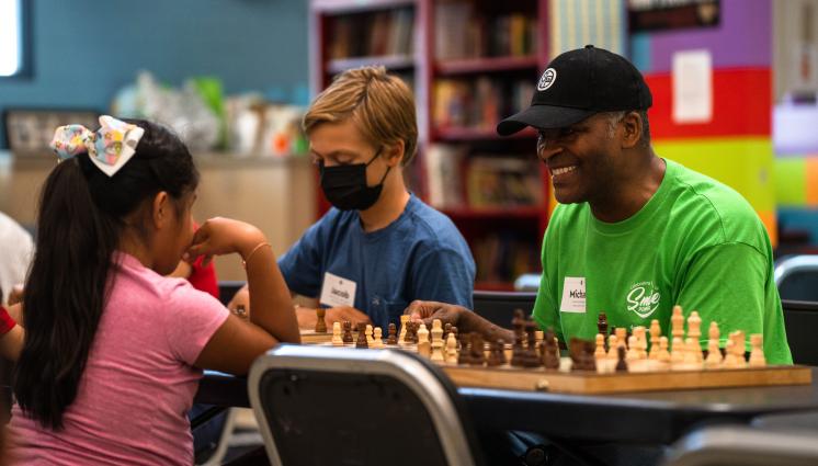 Volunteer playing chess