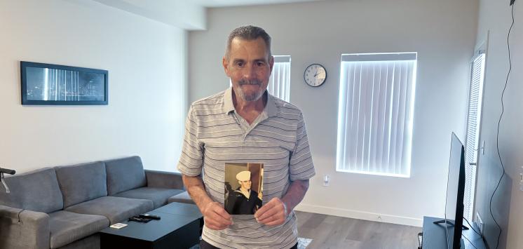 Michael Osborn stands in his new home.