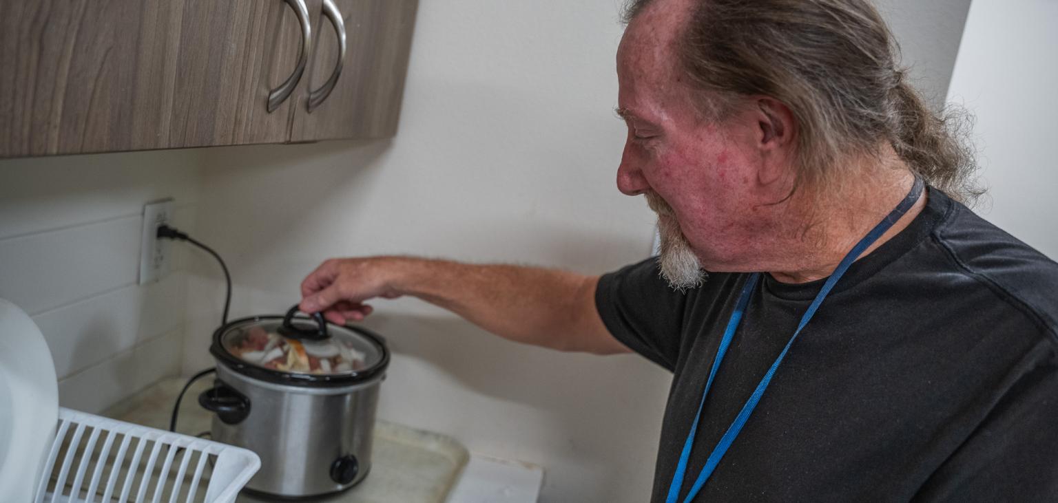 Greg prepares a slow cooker.