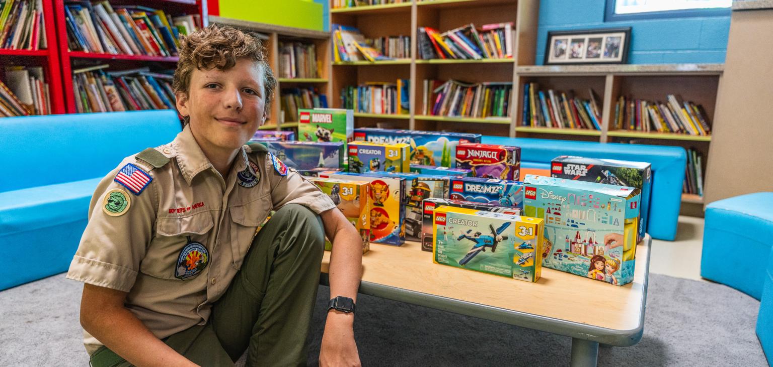 Wilder poses with some of the Lego sets he brought in.
