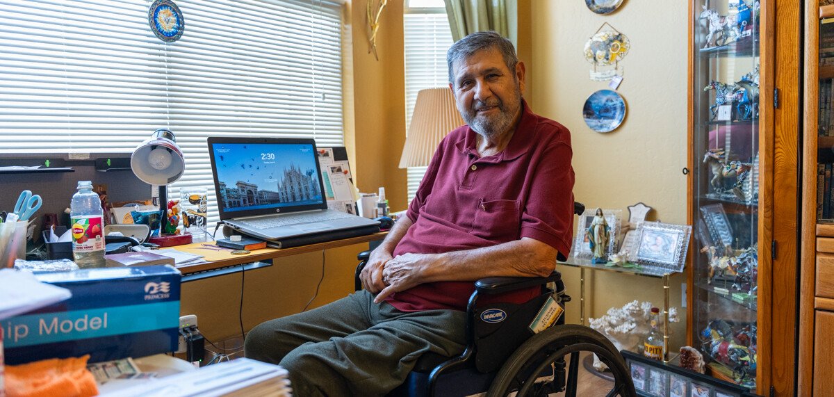 Joseph Granio sits in his living room.