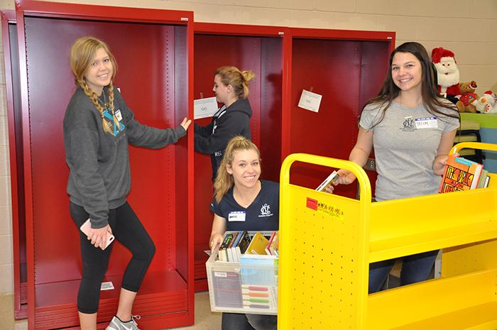 NCL senior students build new bookshelves in Dream Center.