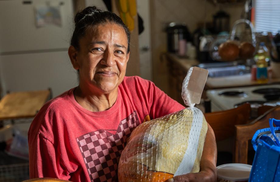 Margarita holds her Turkey from SVdP.