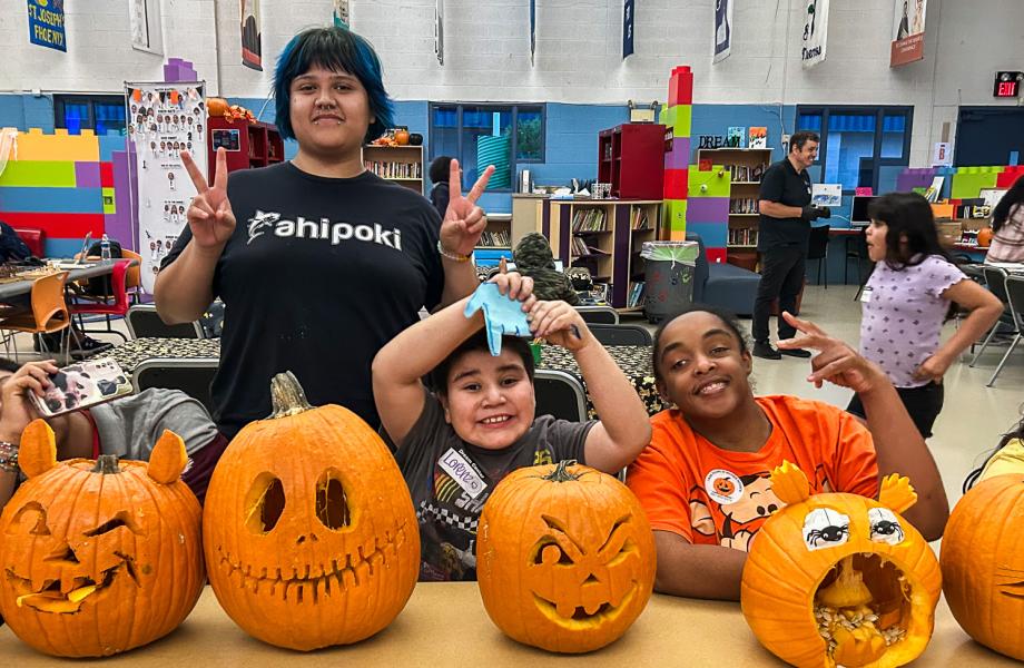 Guests line their pumpkins up for judging in the pumpkin carving contest.