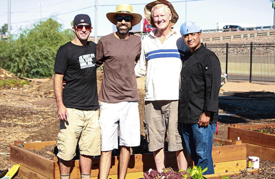 Phoenix food truck owners pose for photo with SVdP Urban Farm staff.