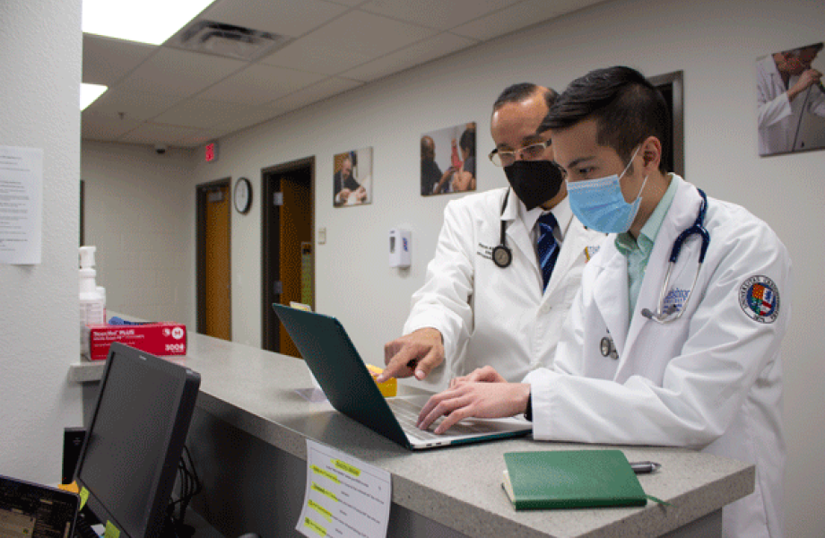 Dr. John Anwar, SVdP medical director and Creighton University assistant professor, mentors a Creighton medical student during a volunteer clinic.