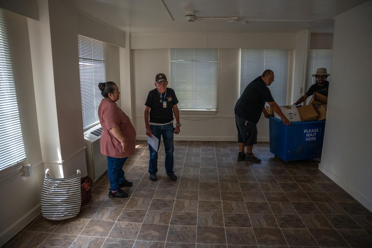 Movers bring items into Bill's apartment