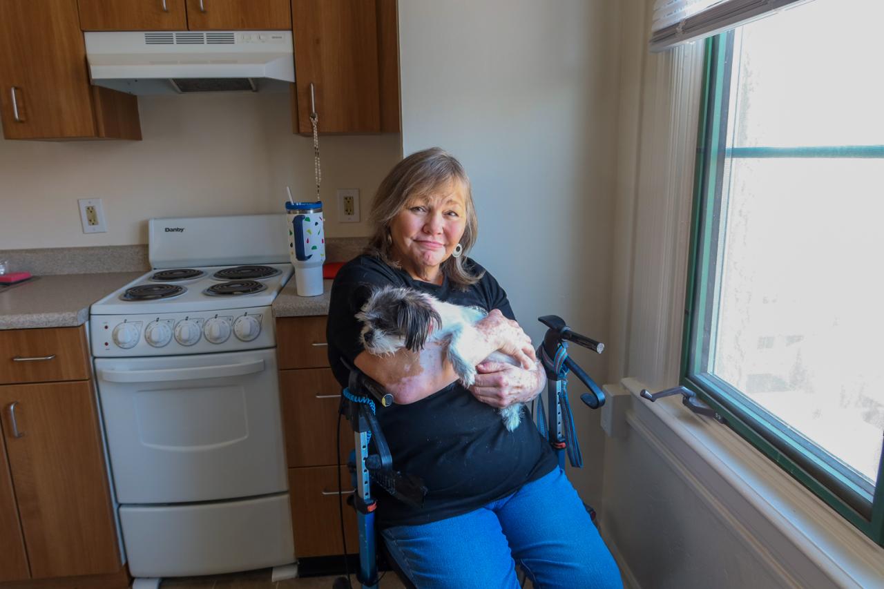 Cindy holding her dog 