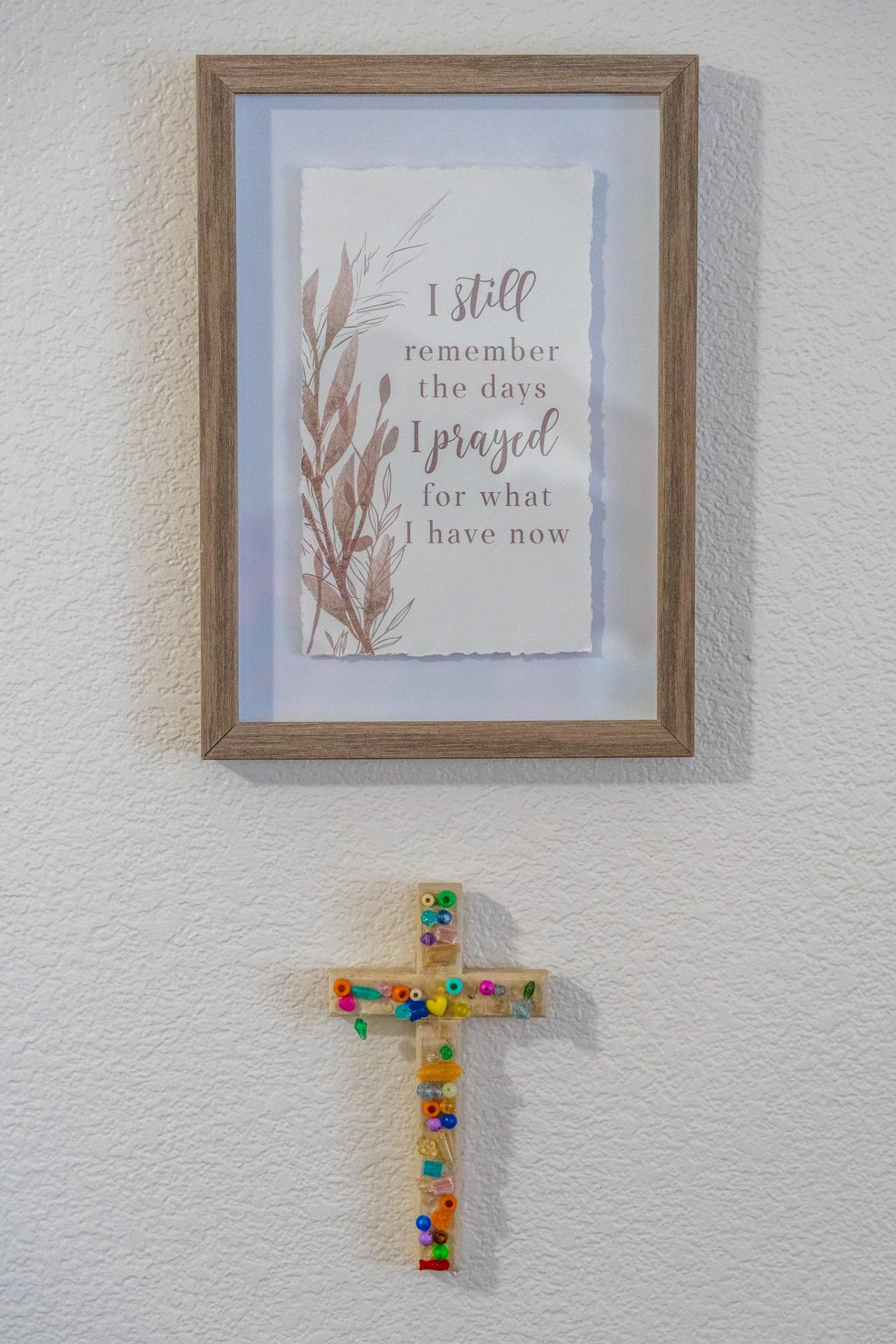 Mando's cross and the frame above it.