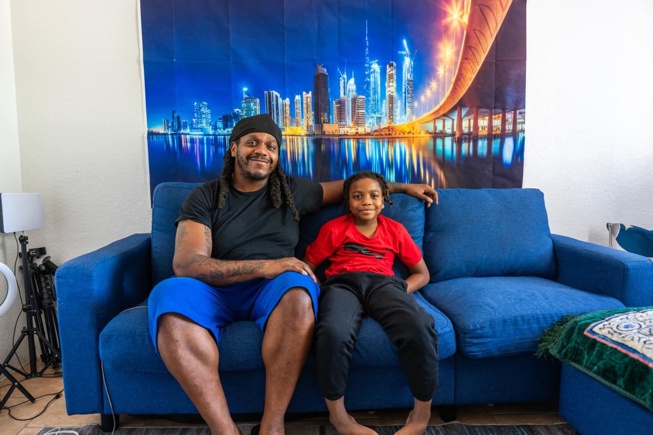 Quentin and his son sitting on the couch