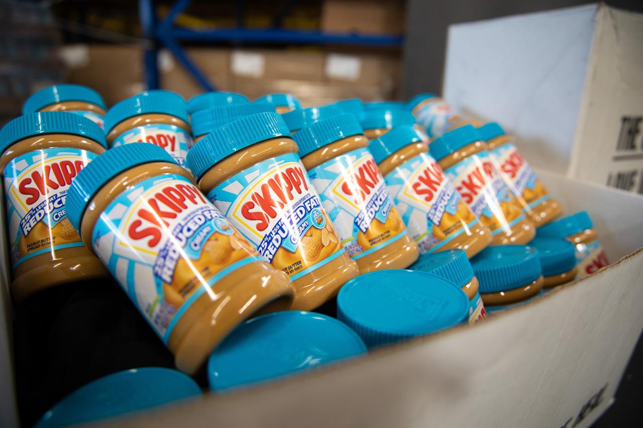 Peanut butter lined up for food boxes.