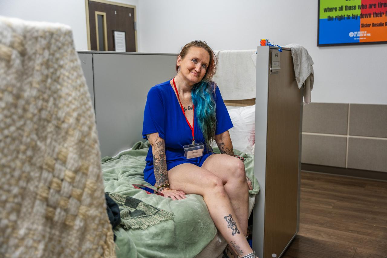 Alinda sits in her space.