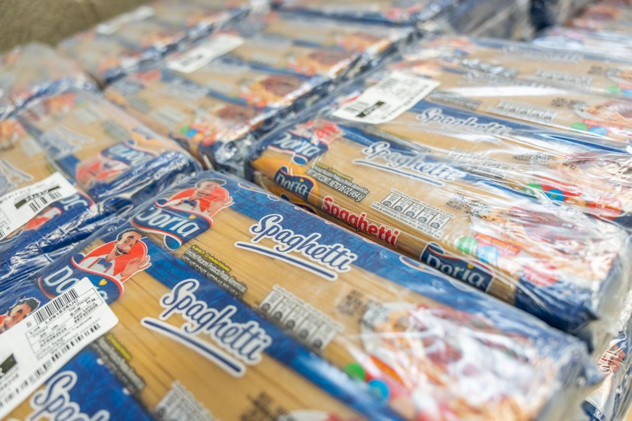 Packs of spaghetti lined up in SVdP's Food Reclamation Center.