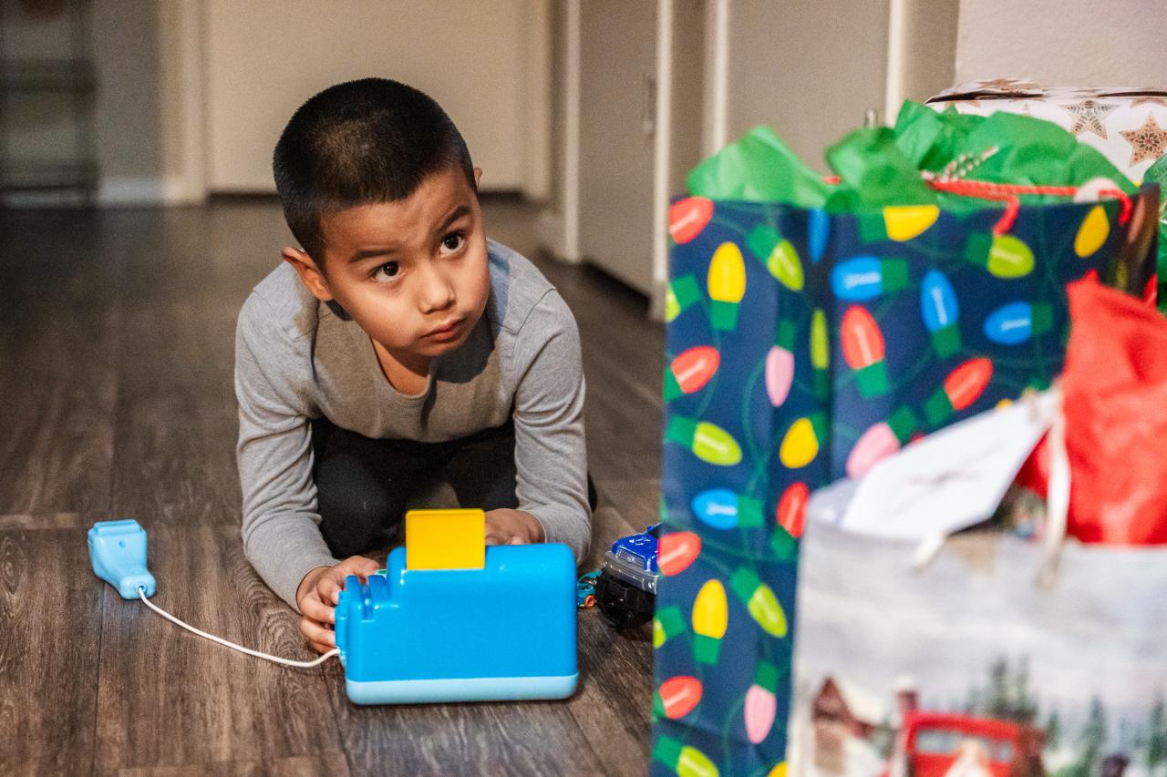 One of the kids enjoys their new present from the AAF program.