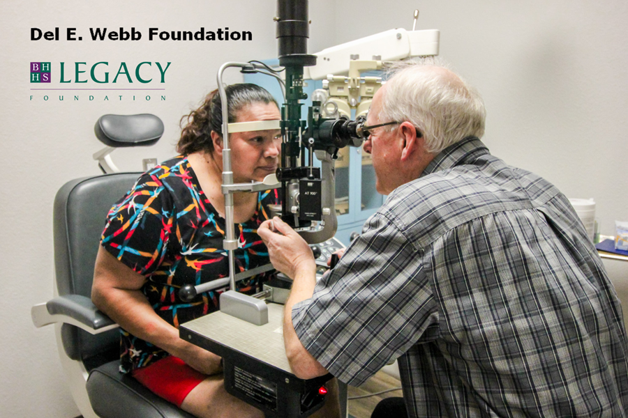 A doctor examines a patient's eyes in SVdP's Medical Clinic.