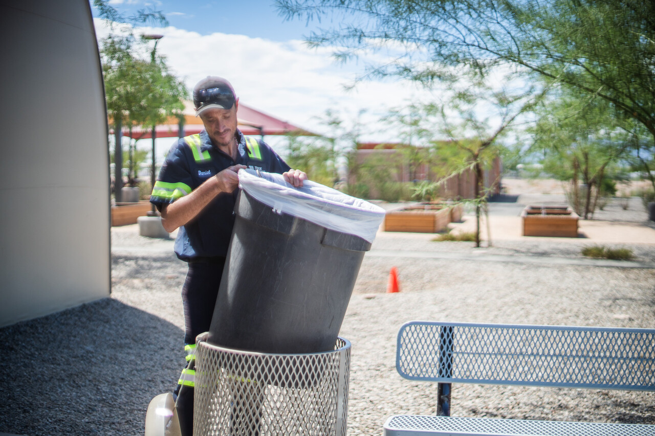Daniel helps clean up as part of the Neighborhood Brigade.